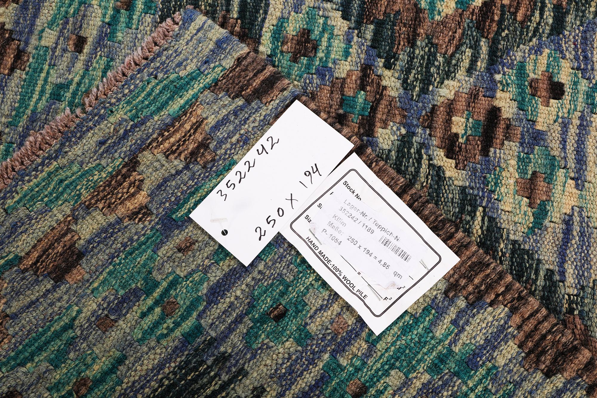 A Kilim rug, c. 250 x 194 cm.