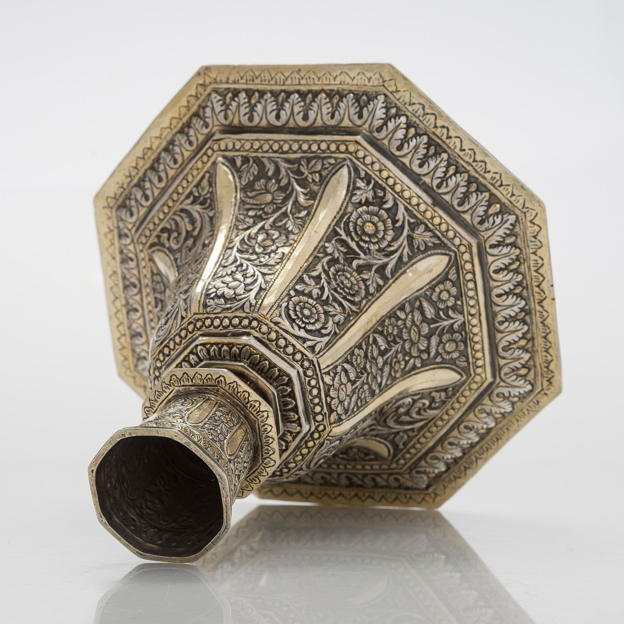 A parcel-gilt silver repoussé water pipe huqqa base, 18th/19th Century.