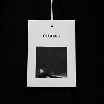 Chanel, a bouclé coat, size 34.