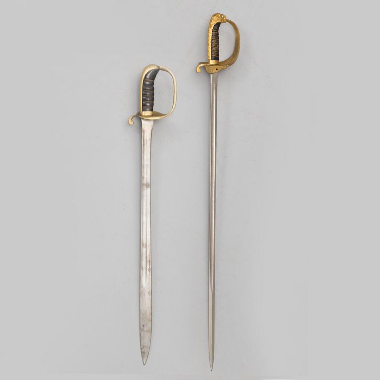 A naval officers sword 1915 pattern and a sword 1876 pattern.