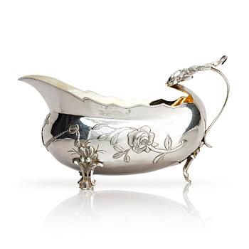 197. A Swedish 18th Century parcel-gilt cream-jug, mark of Erik Ernander, Uppsala 1779.