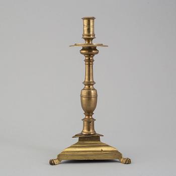 A 17th century bronze candlestick.