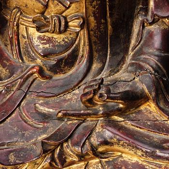 A large gilt and lacquered figure of a seated buddha, Qing dynasty, 19th Century.