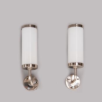 A pair of wall lights manufactured by Taito.