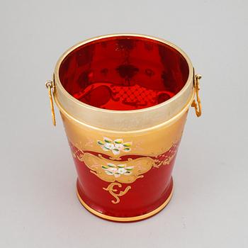 A red glass wine cooler.