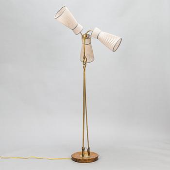 A three-arm floor lamp in brass, mid 20th century.