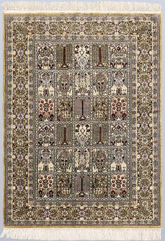 An Oriental silk rug, approx. 122 x 79 cm.