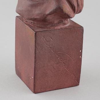 a plaster sculpture, signed.