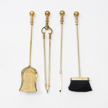 A five-piece brass fire set, late 20th Century.