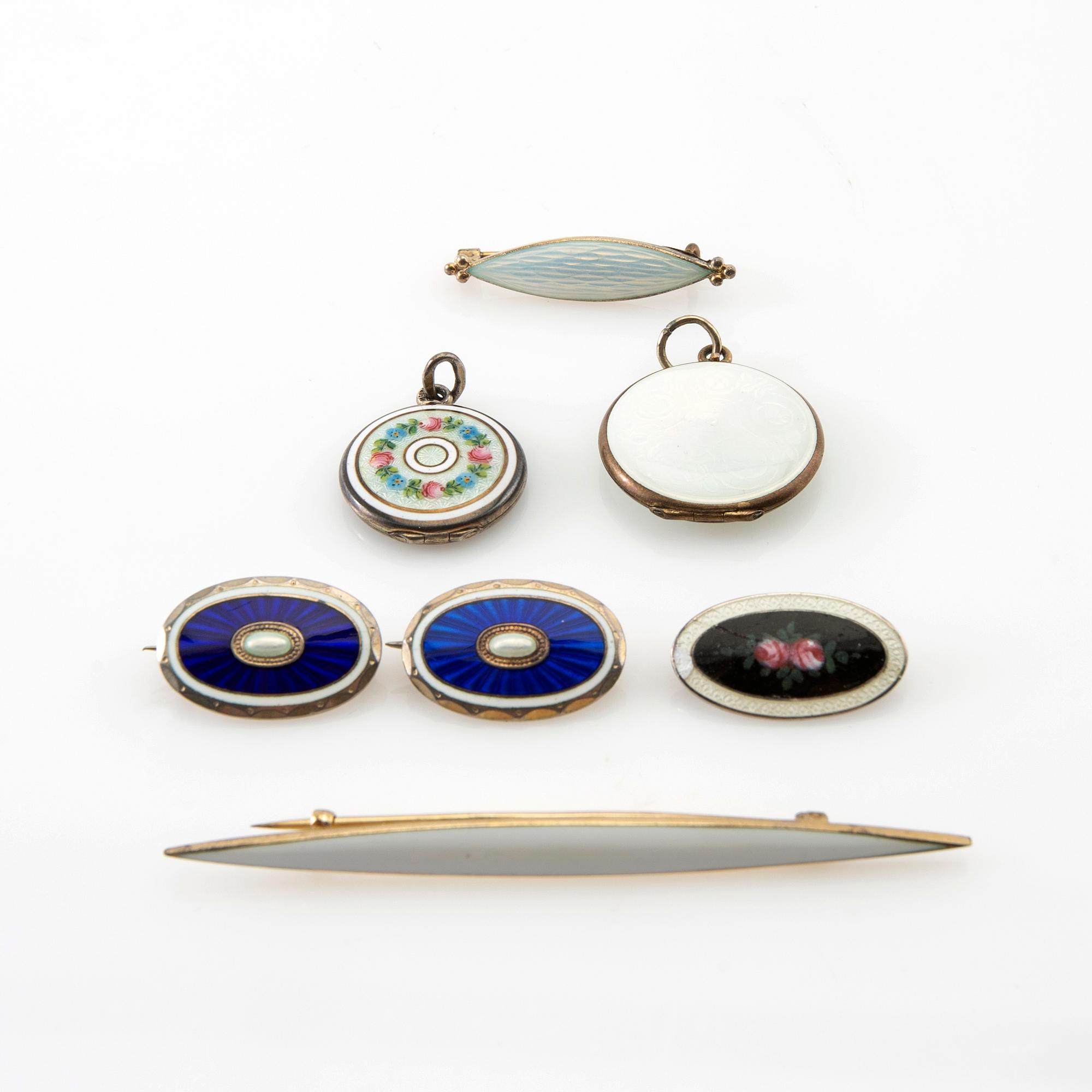 Two pendants and five brooches made of silver and enamel, including Aksel Holmsen, Norway, circa 1900.