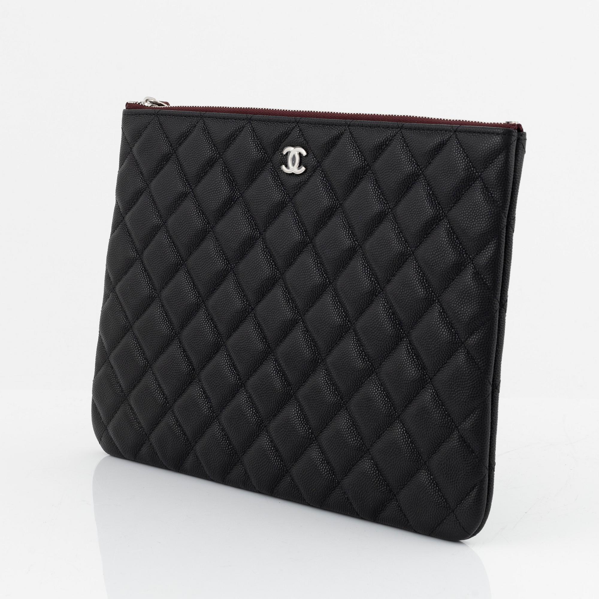 Chanel, a black caviar leather clutch, 2020.