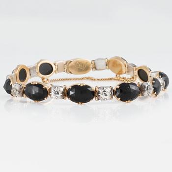 ARMBAND med fasettslipad obsidian samt 9 vita gammalslipade vita safirer och 2 st  fasettslipade vita stenar.