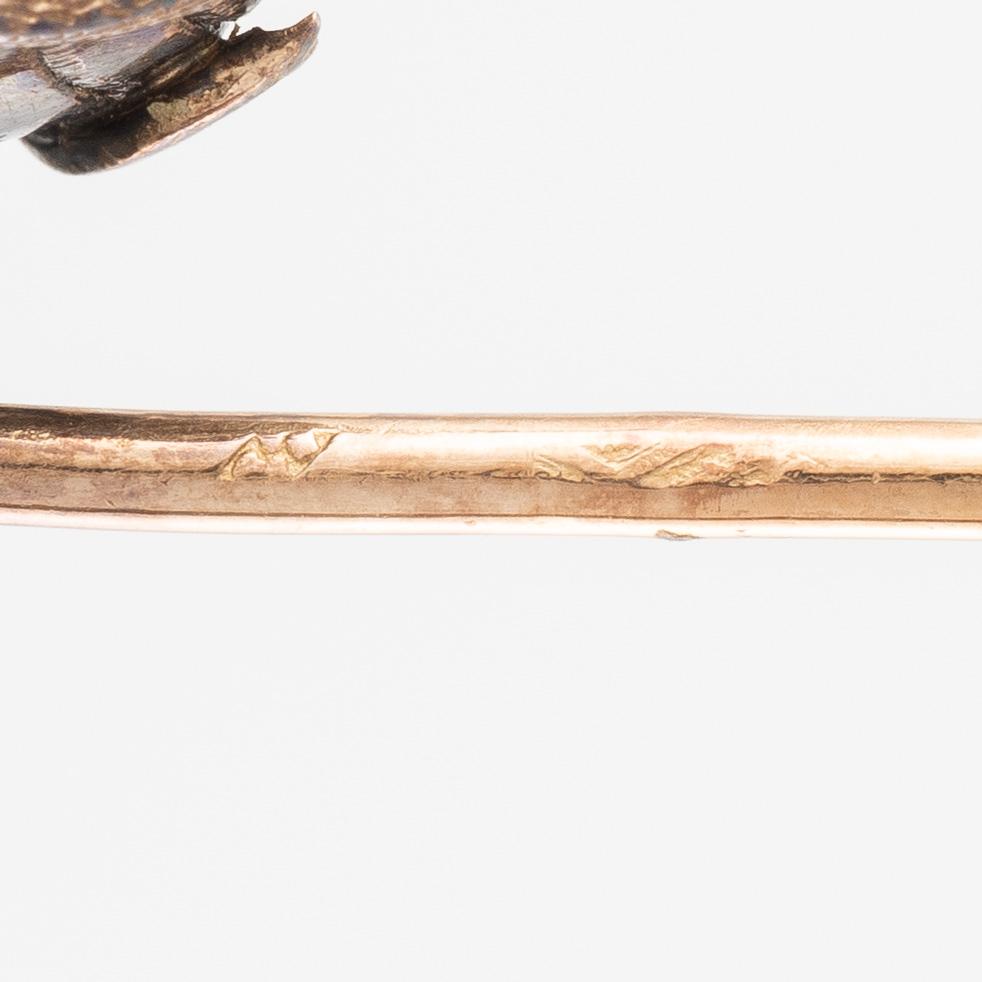 A brooch pin in the form of a beetle, 18K gold and silver with labradorite.