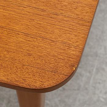A mid20th century dining table.
