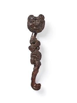 968. A carved wooden ruyi scepter, Qing dynasty/early Republic.