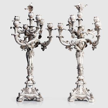 A pair of Swedish mid 19th century silver candelabra, marks of Gustaf Möllenborg, Stockholm 1844.