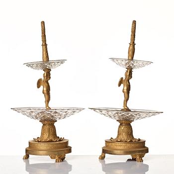 A pair of French Empire early 19th century gilt bronze and glass centre pieces in the manner of Pierre Philippe Thomire.