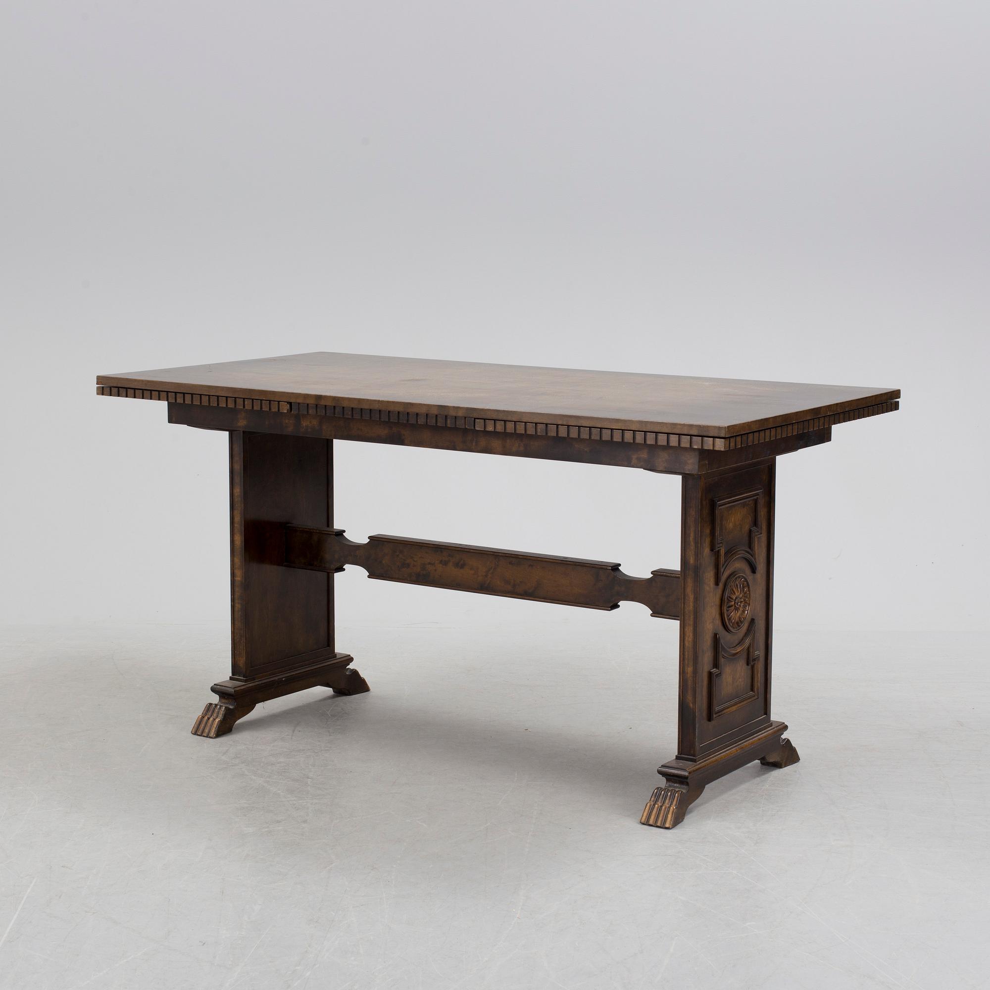 A 1920´s dinner table and six chairs probably designed by Axel Einar Hjorth for AB Svenska möbelfabriken Bodafors.