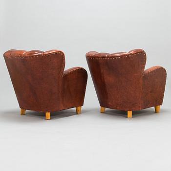 A pair of mid-20th century armchairs.