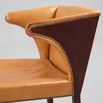 Frits Henningsen, a stained mahogany and brown leather armchair, Denmark.