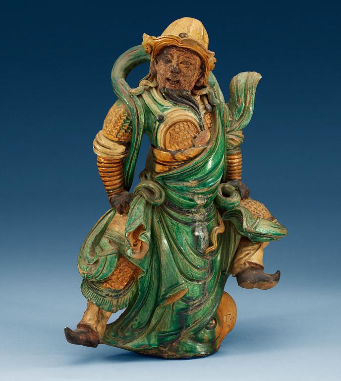 A glazed Ming dynasty rooftile figure of a guardsman, Ming dynasty (1368-1644).