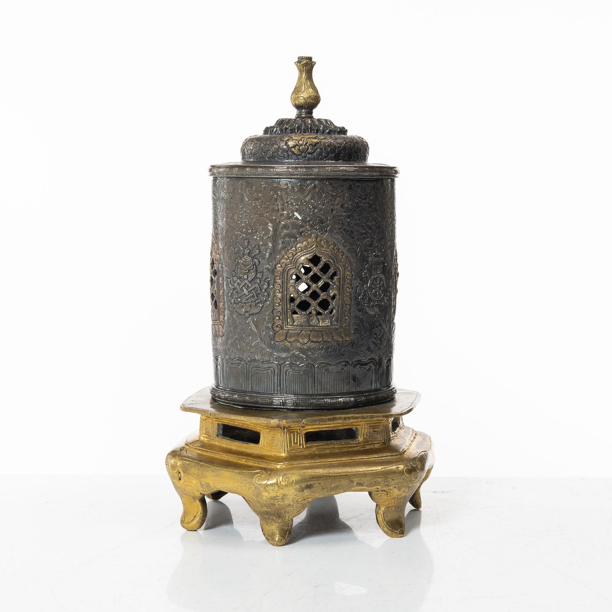 A silvered brass prayer container, Tibet, 20th century.