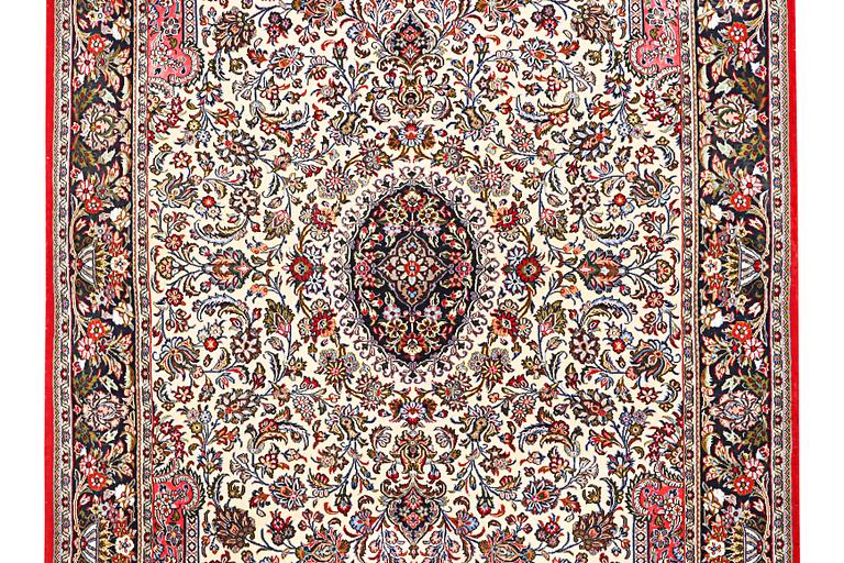 A Quum rug, c. 204 x 134 cm.