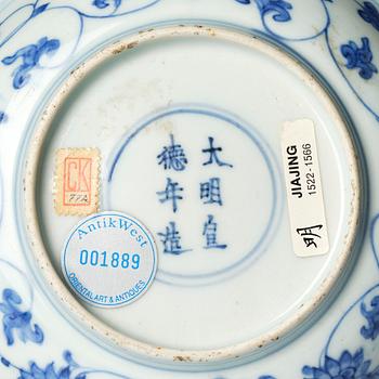 A blue and white dish, Ming dynasty, with a Jiajing mark.