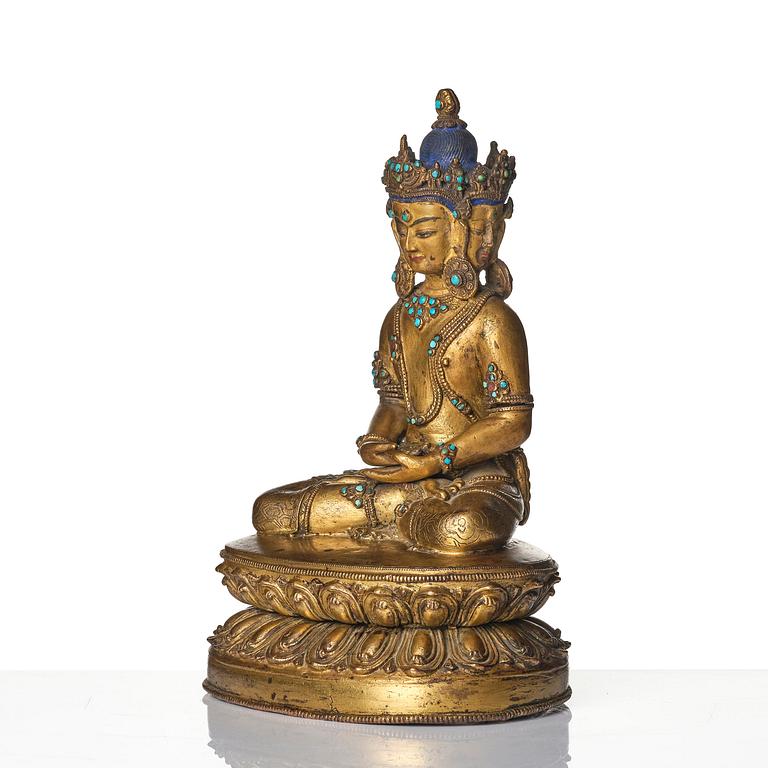 A Tibetan or Nepalese Gilt-Copper Alloy Figure of Sarvavid Vairocana, 15th century.