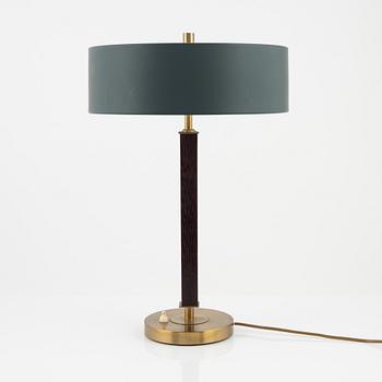 Einar Bäckström, a brass and rosewood table light, Malmö, mid 20th Century.