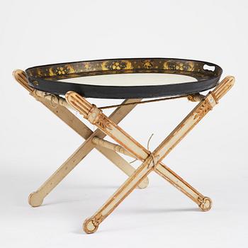 A tole-peinte Empire tray, first part 19th century on a later stand.