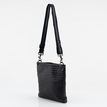 Bottega Veneta, a black intrecciato leather bag.