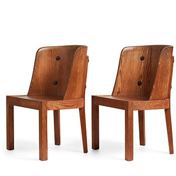 275. Axel Einar Hjorth, a pair of stained pine "Lovö" chairs, Nordiska Kompaniet, 1930's.