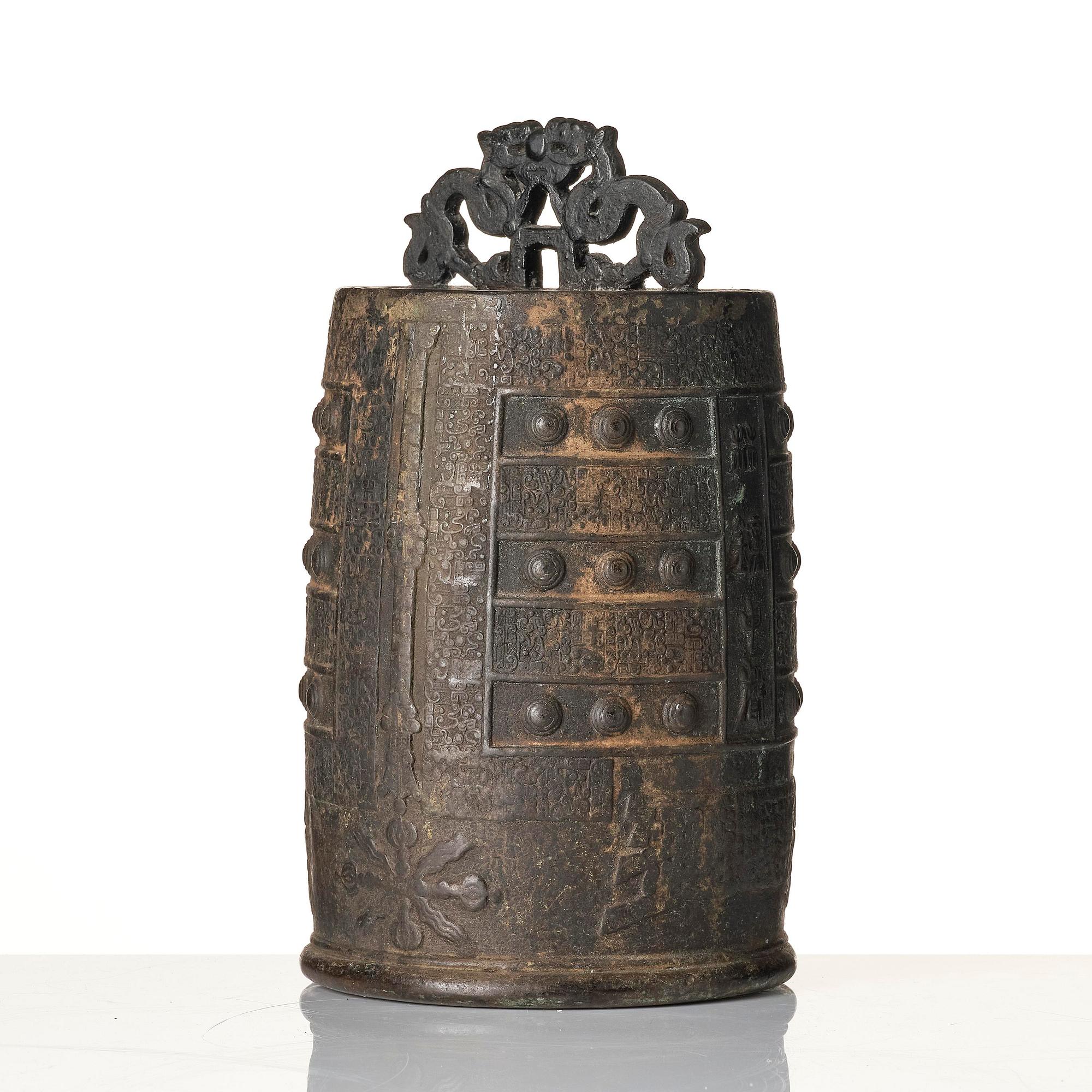 A bronze temple bell with suspension loop (Bo) and coiled and interlaced Dragons, Ming dynasty or older.