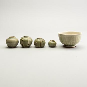 A group of olive green glazed vessels, South East Asia, presumably Thailand.