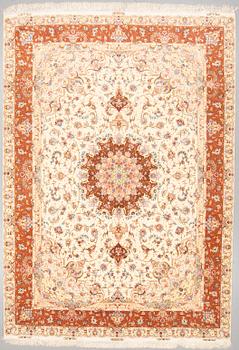 A CARPET, Tabriz, part silk, around 350 x 244 cm.