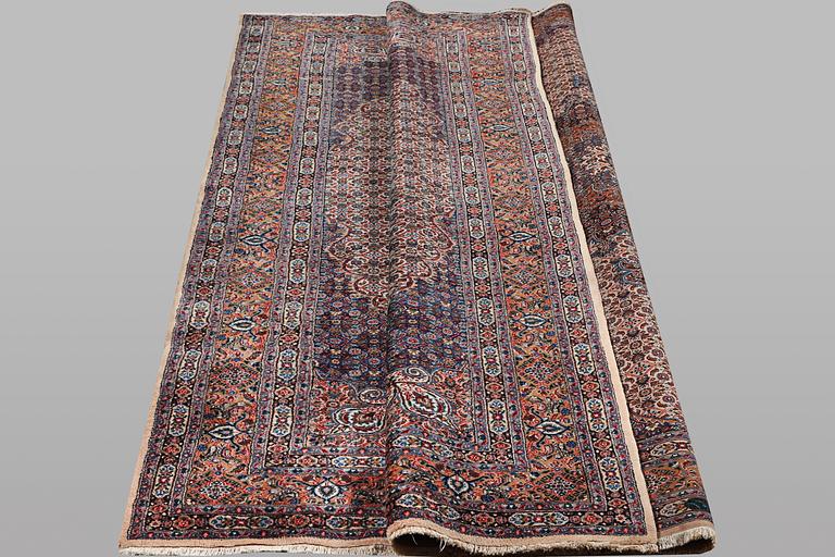 A carpet, Moud, signed, ca 385 x 268 cm.