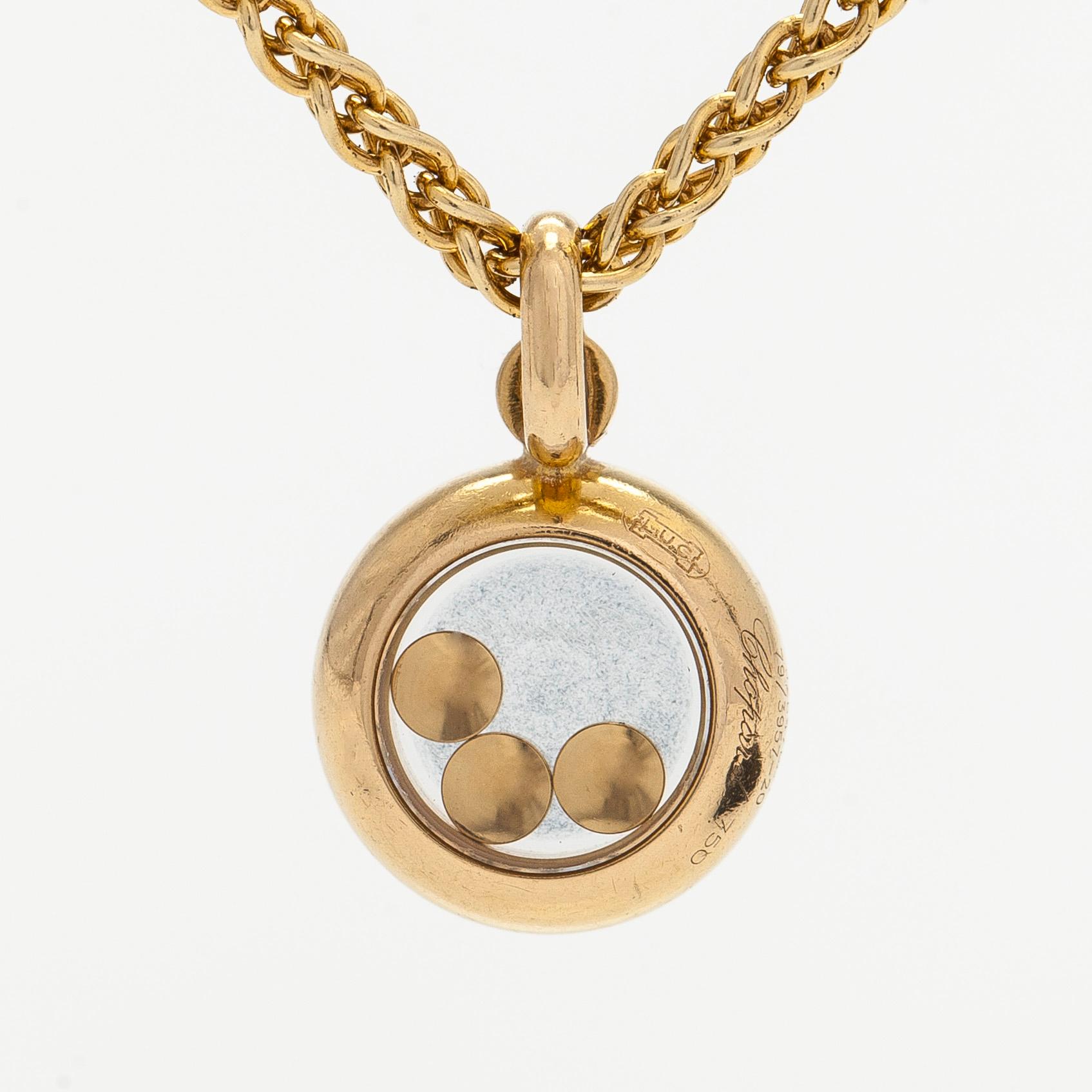 Chopard, an 18K gold 'Happy Diamonds' necklace with brilliant-cut diamonds.