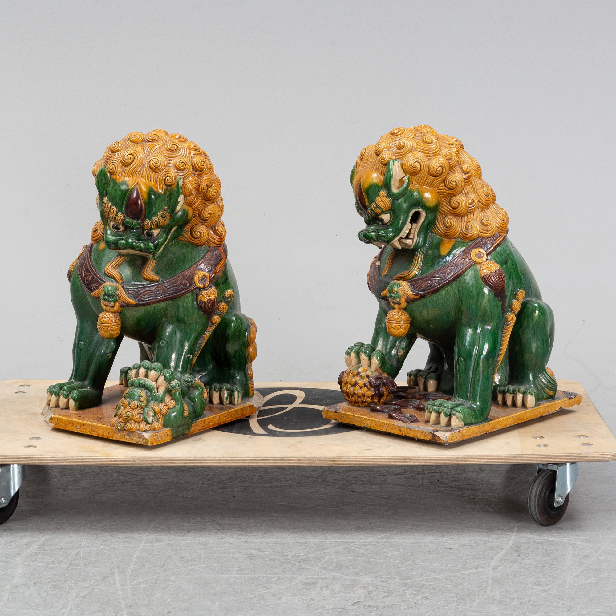 A pair of sancai-glazed chinese buddhist lions or guardian lions, early 20th century.