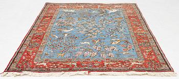 A Quum rug, figural, c. 210 x 142 cm.