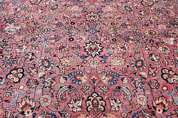 An antique Mashad carpet, signed Saber, c. 405 x 295 cm.