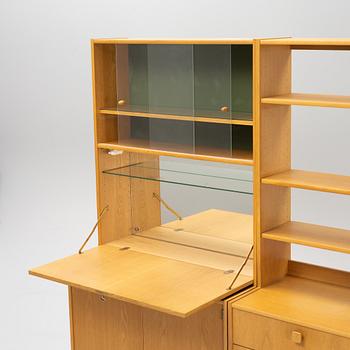 Bertil Fridhagen, an oak-veneered bookcase system, 4 sections, second half of the 20th century.