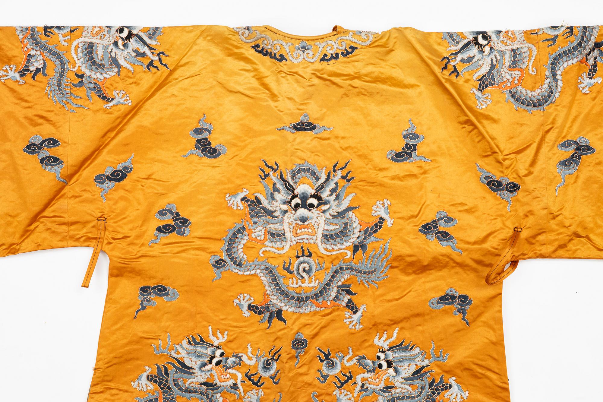 A Chinese embroidered silk robe, 20th century.
