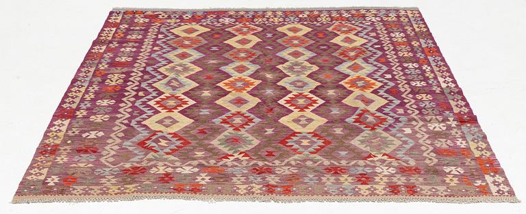 A Kilim rug, c. 245 x 205 cm.