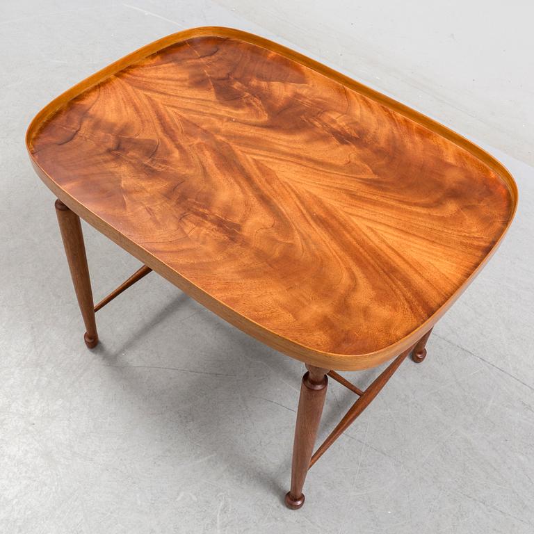 A mahogany veneered model 974 side table from Svenskt Tenn.