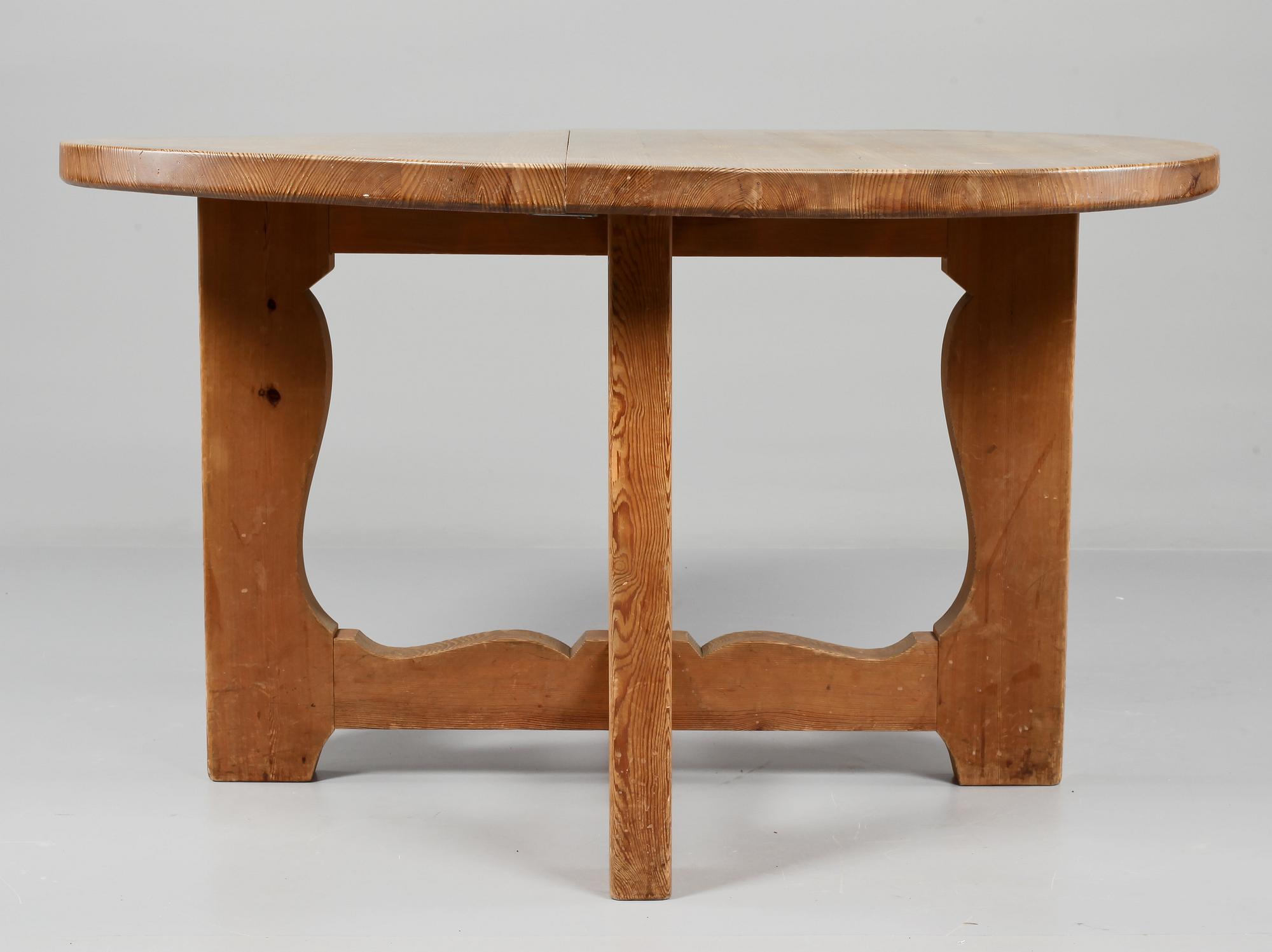 A stained pine dining table, attributed to Axel Einar Hjorth, Nordiska Kompaniet, 1930's.