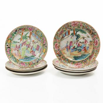 A matched set of 14 famille rose 'Canton' dinner plates, Qing dynasty, 19th century.
