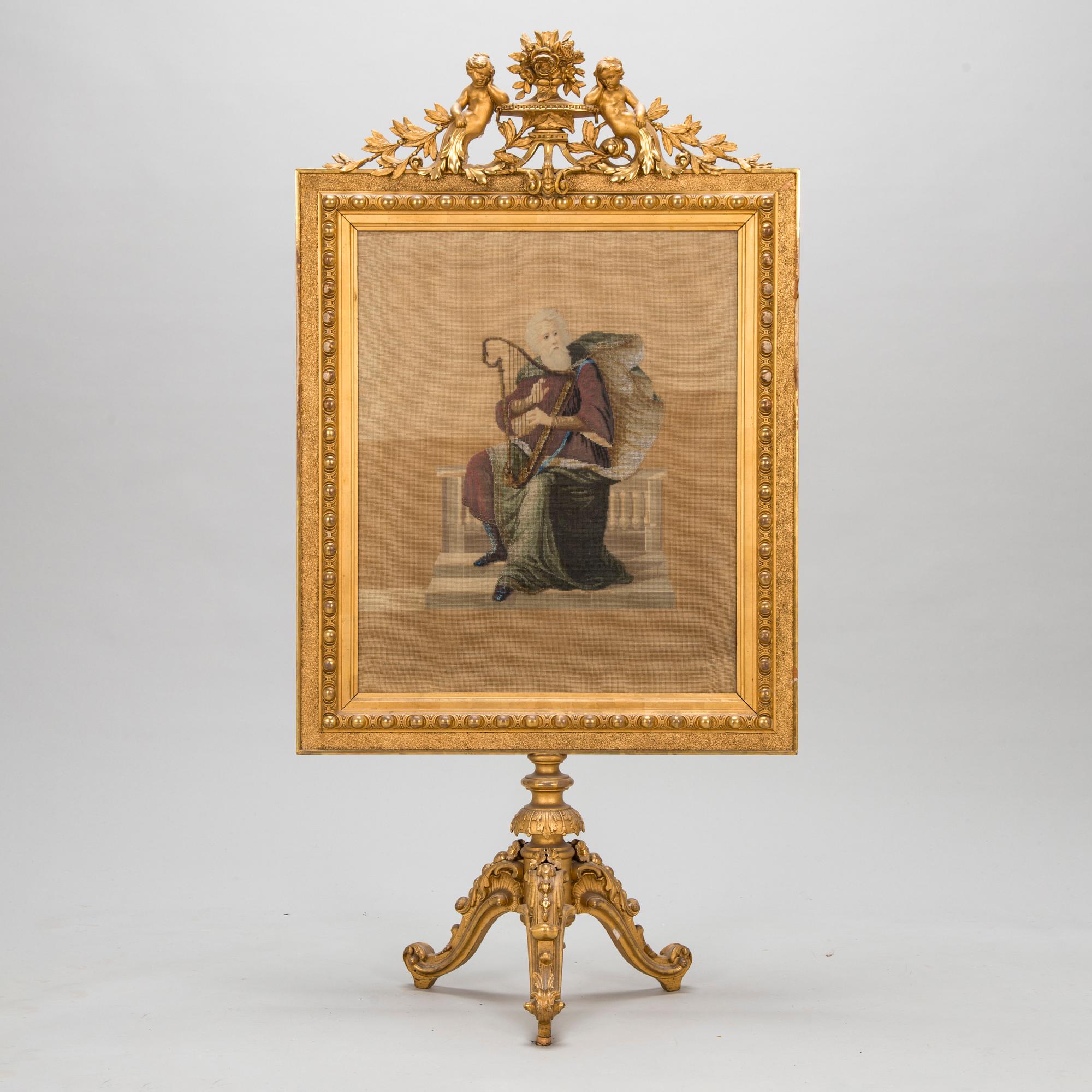 A late 19th century fire screen.