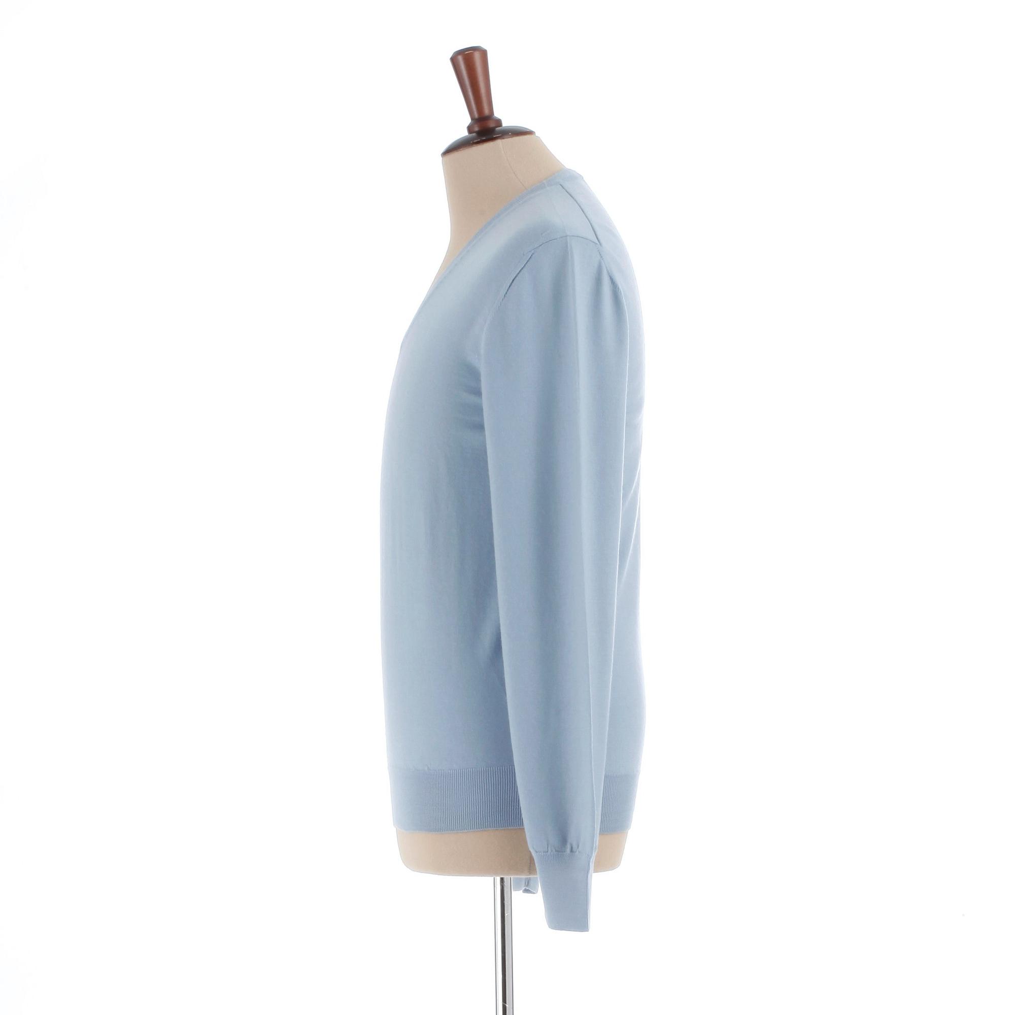 YVES SAINT LAURENT, a men's blue wool sweater, size M.