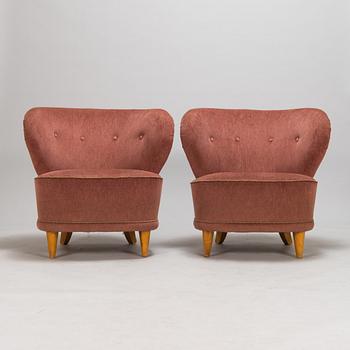 A pair of 1950s armchairs.